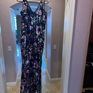 This is a long fitted sequin dress size medium. Never worn new with tags.